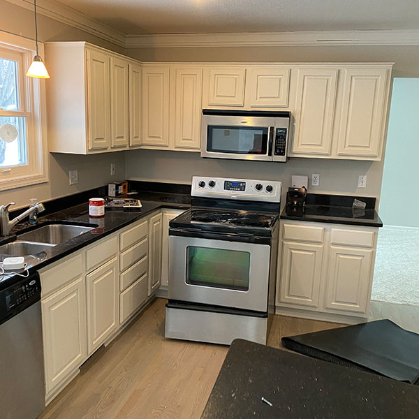Kitchen with black granite now with white cabinets